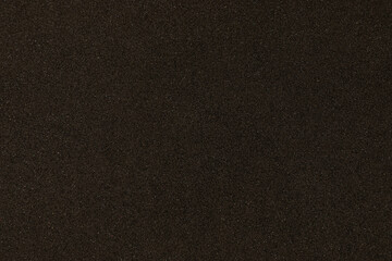 Black texture with micro-relief and glitter. Black glitter texture