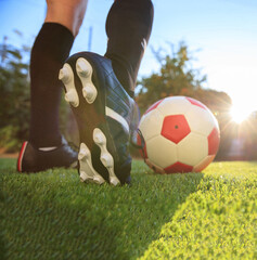 Female soccer football. Woman athlete ready to kick the ball