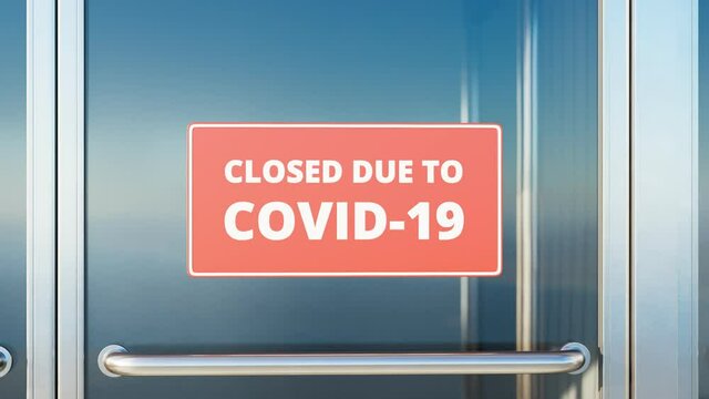 Closed due to COVID-19. Zooming in red close sign on the glass front door. 4K HD