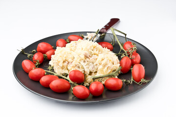 Russian salad. With red tomatoes, with white background.Spain