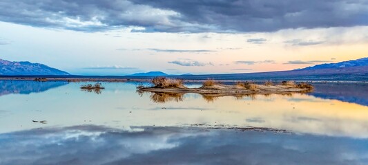scenic lake near death valley with dark clouds in the national park
