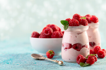 Delicious berry yogurt with fresh raspberries.