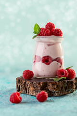 Berry yogurt with fresh raspberries and mint.