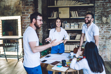 Cheerful colleagues communicating during break