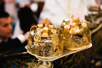 Fototapeta na wymiar Golden crowns lying on the table in church