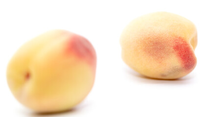 Ripe peach isolated on a white background.