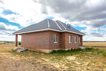 Fototapeta na wymiar New brick cottage in the village