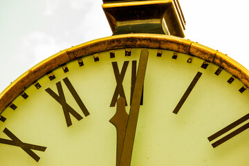 Close up of a retro clock and time is 12 o'clock.