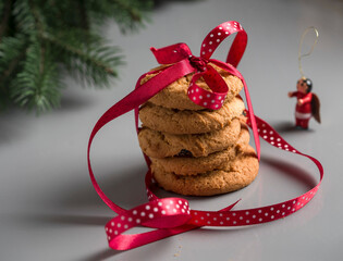 Santa's cookies under the tree. Cookies with a red ribbon.
