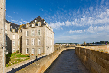 Fototapeta na wymiar Waterfront view of beach townhouses and skyline, Saint-Malo, Brittany, France