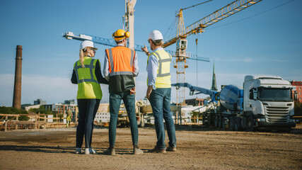 Diverse Team of Specialists Stand with Their Backs on Construction Site. Real Estate Building Project with Civil Engineer, Architect, Business Investor Discussing Planning and Development Details.