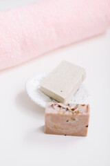Spa set. Bar of handmade soap, candle and towel. Accessories for personal hygiene. Decor for bathroom interior