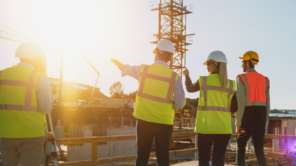 Diverse Team of Specialists Are on Construction Site. Real Estate Building Project with Civil...