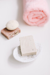 Spa set. Bar of handmade soap, candle and towel. Accessories for personal hygiene. Decor for bathroom interior