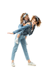 mother imitating plane with daughter on back isolated on white