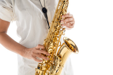Obraz premium Close up woman playing saxophone isolated on white studio background. Inspired musician, details of art occupation, world classic instrument for jazz and blues. Concept of hobby, creativity.