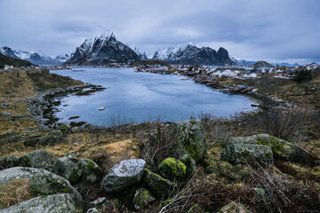 Fototapeta na wymiar Amazing panoramic view on lovely arctic village Reine on Lofoten islands in a cloudy day in Norway.