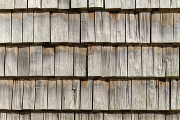 The wooden wall of the building. The pattern of wooden wall.