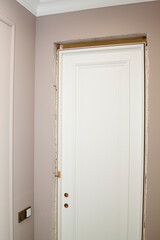 close up view of installed door with opening filled with mounting foam