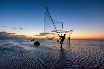 Shadow fishermen in the early morning.