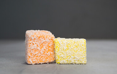 orange and yellow delicious Turkish Delight on gray background