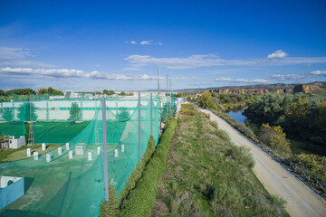 aerial view of a road area with river and playground