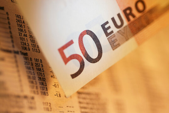 Close-up of a fifty Euro banknote on a financial newspaper