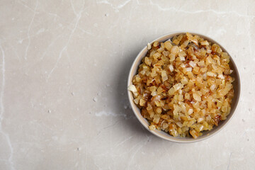 Tasty fried onion on grey marble table, top view. Space for text