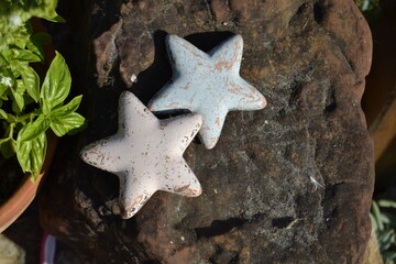 blue and pink stars on a stone