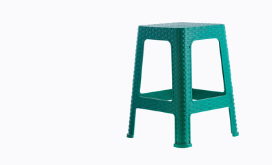Green plastic chair isolated on white background