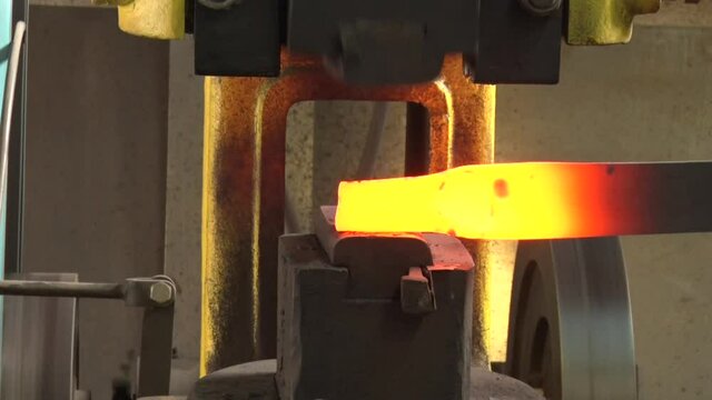 The Machine Automatically Hits The Hot Iron