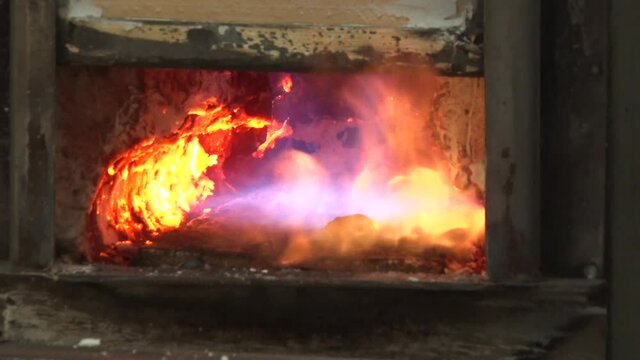 Oven With A Flame For Heating Iron