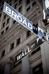 Obraz premium Low angle view of street name signs with a building, Wall Street, Manhattan, New York City, New York State, USA