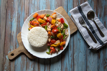 Top view of rice with vegetables and meat on a background