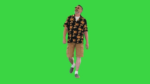 ool grandpa tourist walking and looking to the sides on a Green Screen, Chroma Key.