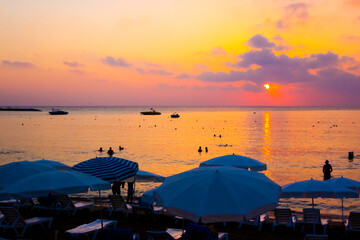 Beautiful orange-purple sunset over the sea beach