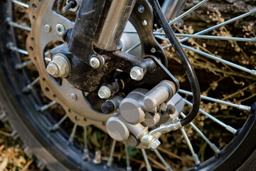 Fototapeta na wymiar Motorcycle front wheel brake. Close-up. Selective focus.