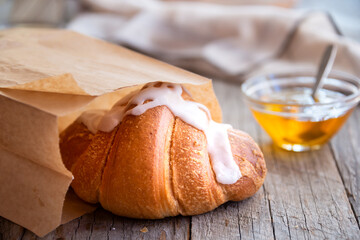 Fresh baked sweet croissants with jam or honey for breakfast