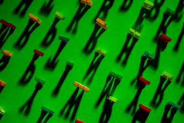 Latin letters and their shadows. Shadows from English letters on a green background. The concept of learning the alphabet and getting an education. The letters are taken from the top on a green.