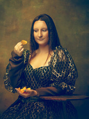 Tastiest chips. Young woman as Mona Lisa, La Gioconda isolated on dark green background. Retro style, comparison of eras concept. Beautiful female model like classic historical character, old