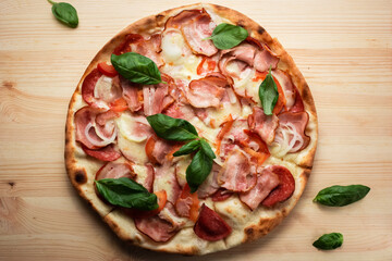 pizza with salami tomatoes and Basil