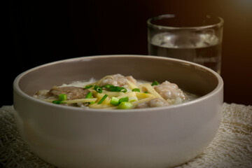 Pork Congee, Boiled rice with pork in a bowl. Asian food they usually eat it in the morning.