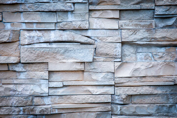 Rough texture of rock wall, The wall has a specific stone pattern.