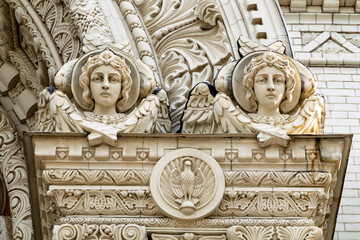 Angel face. Decorative stone detail on the facade of the Navy Cathedral of St. Nicholas in Kronstadt, St. Petersburg, Russia