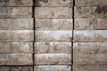 Repair of the sidewalk and laying of paving slabs on the walkway. Blocks of paving slabs are stacked on a pallet. Laying paving slabs in the pedestrian zone of the city, sand filling.