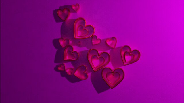 The face of a woman created from the shadow of hearts on a pink background. Computer generated animation. Concept of love.