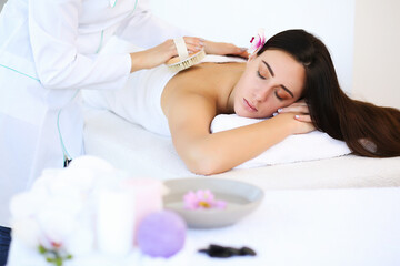 Obraz na płótnie Canvas massage therapy. enjoying a massage in the spa