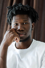 Close-up portrait of young African American man with dreadlocks