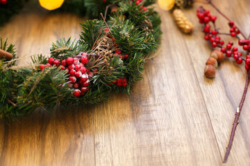 Christmas wreath on wooden rustic background in house.