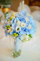 bouquet in the hands of the bride